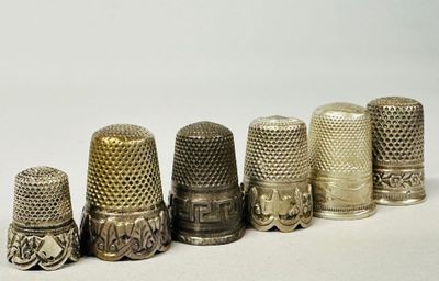 several different types of thimbles are lined up in a row
