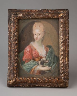 un tableau représentant une femme tenant un chat dans ses bras