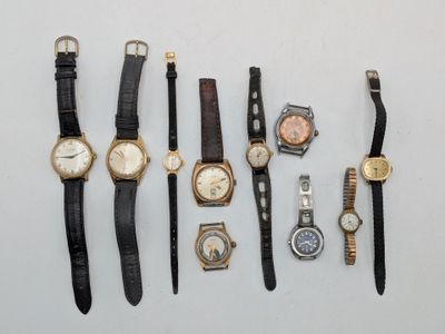 several different types of watches are arranged in a row on a table