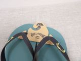 a pair of flip flops with a tag on them