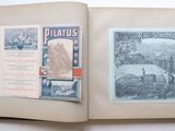 an open book with a picture of a mountain scene on it