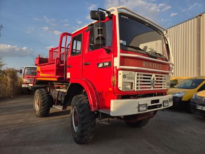 a large red truck that is parked in a parking lot