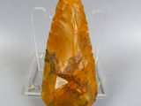 a large piece of rock that is on a clear stand