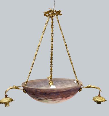 a close up of a hanging light fixture on a gray background