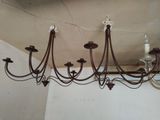 a chandelier hanging from the ceiling in a room