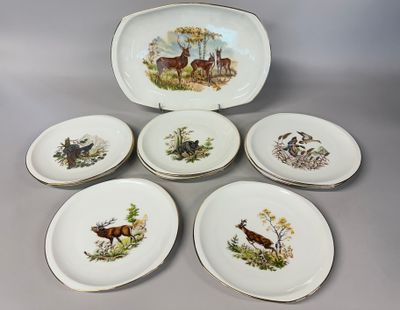 six plates with different designs of animals on them sitting on a table