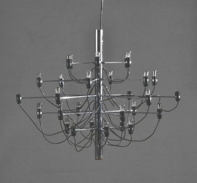 a black and white photo of a chandelier hanging from the ceiling