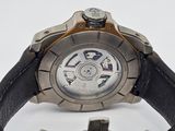 a close up of a watch on a white surface