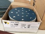 a box of sanding discs on a table next to a box of discs
