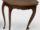 an image of a wooden table with a curved top