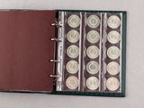 a book with a bunch of coins inside of it