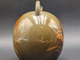 an image of a vase with a design on it