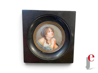 painting of a woman in a blue dress in a black frame on a white background