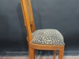 an image of a chair with a leopard print seat and back