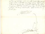 un vieux document sur lequel figurent une lettre manuscrite et un stylo