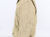 the back of a beige jacket on a mannequin mannequin head
