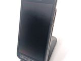 a cell phone that is sitting on top of a stand