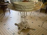 a table with a bowl on it in the middle of a room