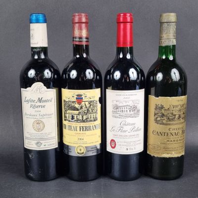 four bottles of wine are lined up on a table