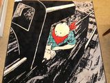 a rug that has a picture of a cat in a car