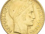 an image of a gold coin with a woman ' s head on it