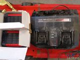 an image of a red and black invertor in a box
