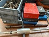 a lot of tools sitting on the floor next to each other