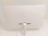 a white computer monitor sitting on a white table