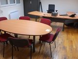 a room with a table and chairs in it
