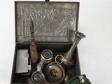 a small metal box with a tea pot and other items in it