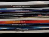 a stack of dvds stacked on top of each other