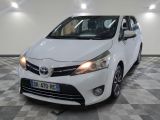 the white toyota yaris is parked on a checkered tile floor