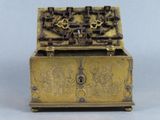 a gold box that has a lock on it