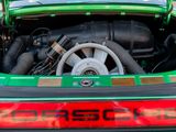 a close up of a car ' s engine with the hood open