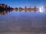 a reflection of a boat on the water in the water