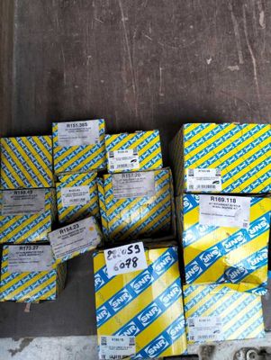 several boxes of yellow and blue boxes on top of a wooden floor