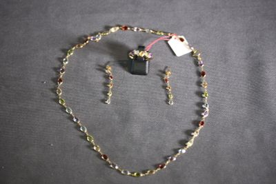 a necklace and earring set on a table