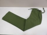 olive green pants on a white table with a pair of scissors