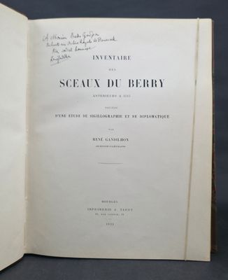 an open book with a black and white image of a man