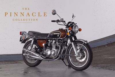 a motorcycle that is parked in front of a wall