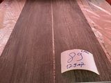 a close up of a wooden table with a price tag on it