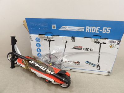 a toy motorcycle and a scooter in front of a box