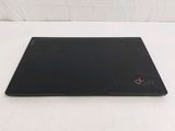 the laptop is on a white surface with a white background