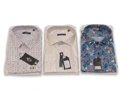 three men ' s dress shirts are lined up on a white surface
