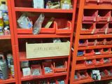 a red shelving with lots of tools in it