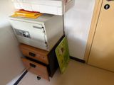 a stack of boxes on top of each other in the corner of a room