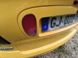 a close up of a car ' s rear end with a sticker on it