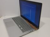 a laptop computer sitting on a table with a blue screen