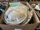 a cardboard box with a stuffed animal inside of it
