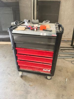 a black and red tool cart with tools on it